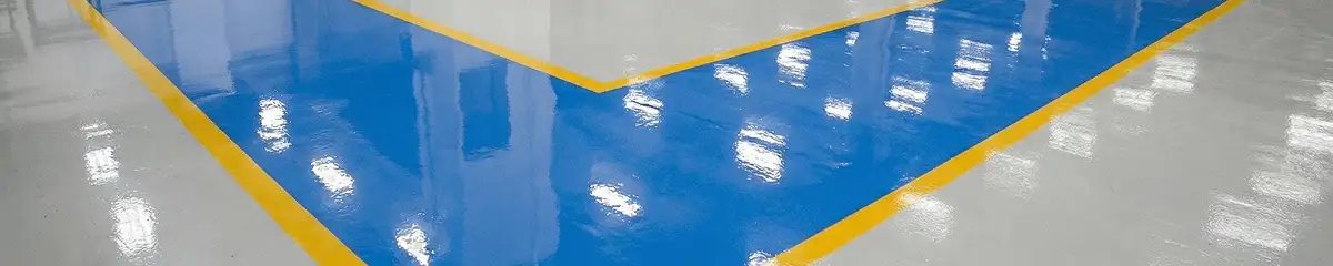 A factory floor professionally covered and marked with epoxy flooring in Boca Raton, FL
