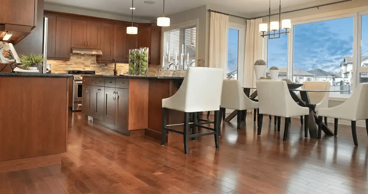 A modern kitchen with professionally installed wood flooring in Boca Raton, FL