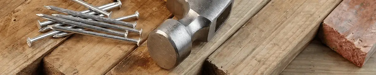 Hammer and nails on hardwood flooring boards in Boca Raton, FL