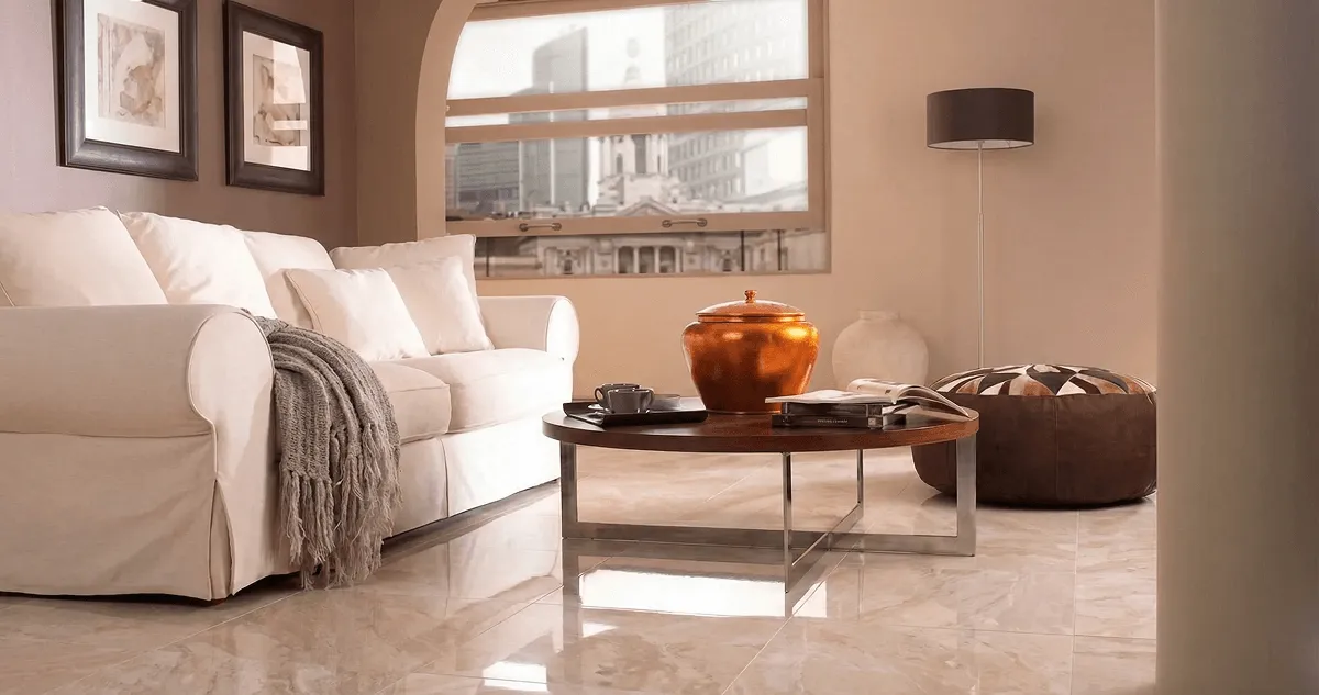 Modern living room with professionally installed marble flooring, a beige sofa, coffee table in Boca Raton, FL