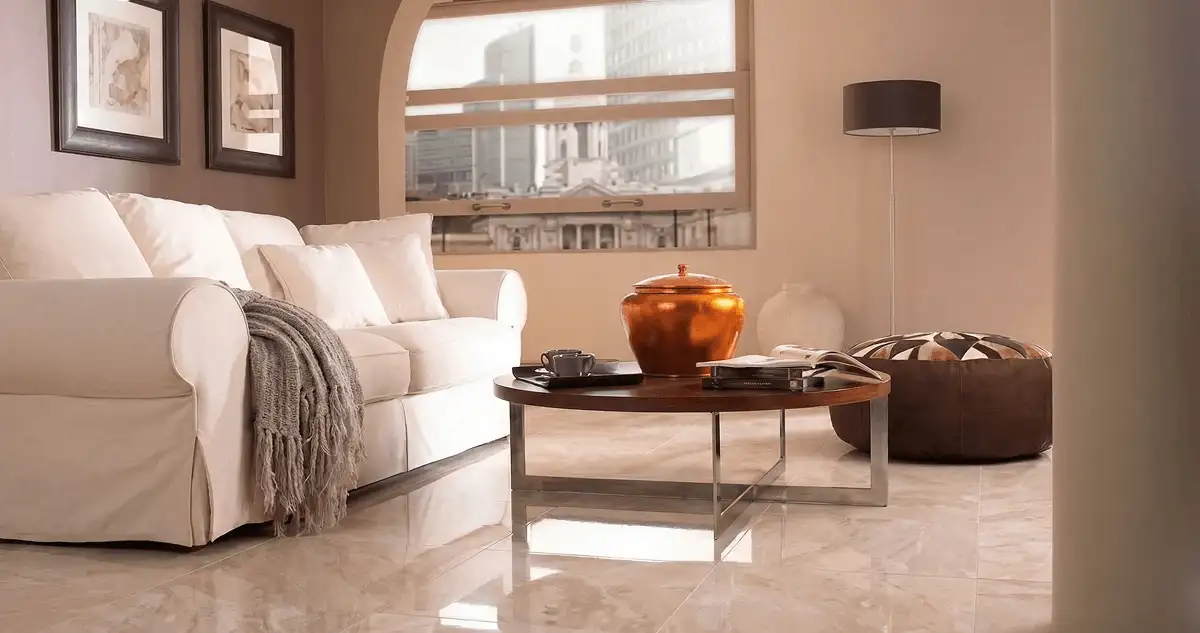 Modern living room with professionally installed marble flooring, a beige sofa, coffee table in Boca Raton, FL