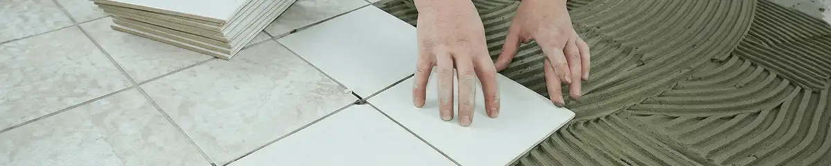 Professional installing white tile floors in Boca Raton, FL