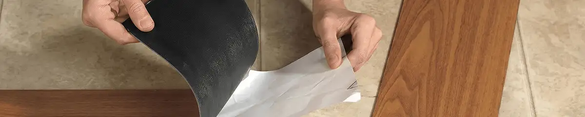 A professional installing vinyl flooring in Boca Raton, FL