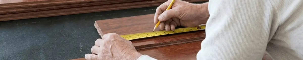 A professional installing wood flooring in Boca Raton, FL